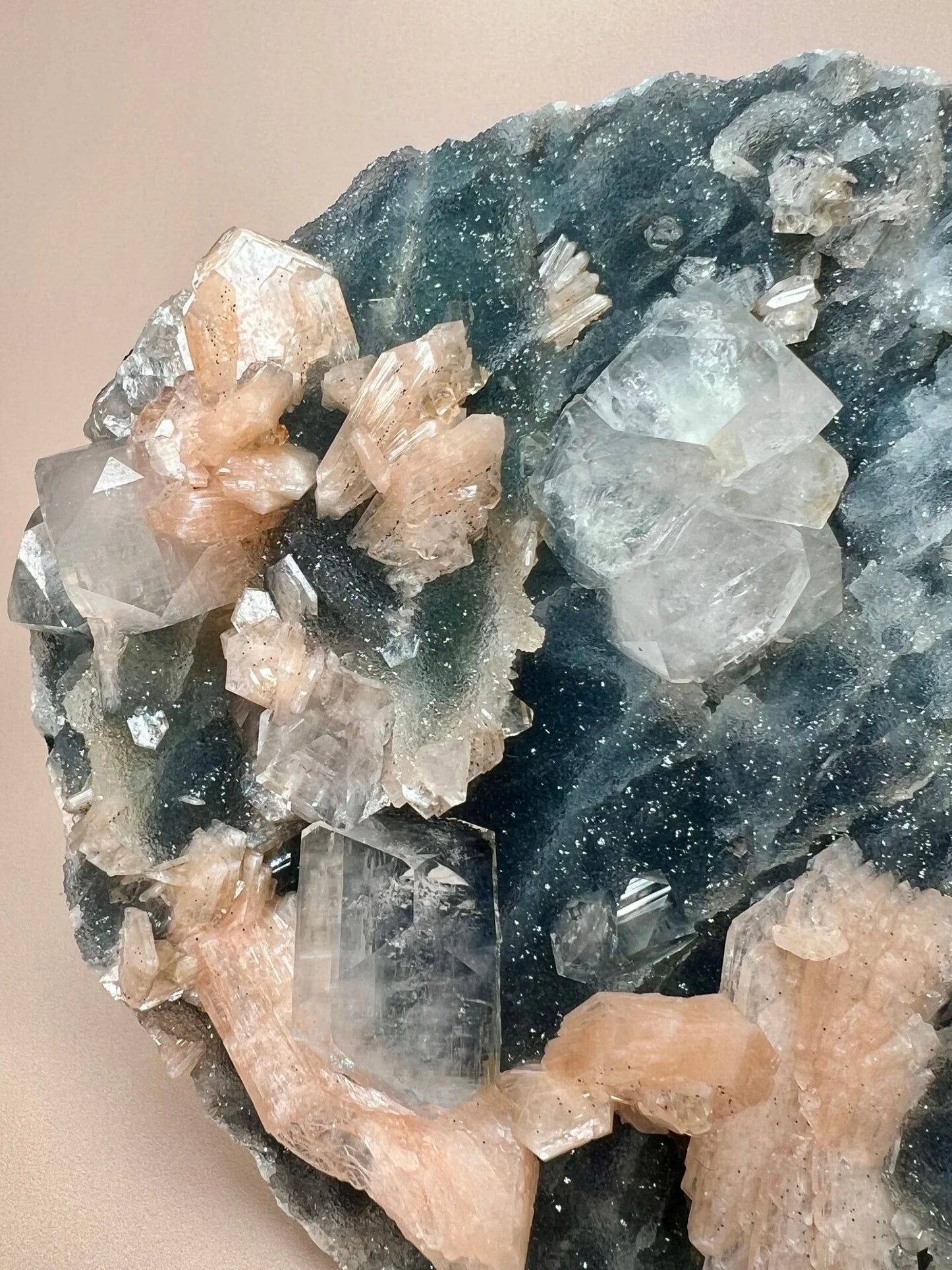 Blue chalcedony slab with clear apophyllite and peach stilbite crystal clusters