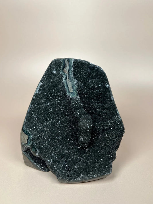 Black druzy chalcedony freeform crystal with sparkling surface and natural texture